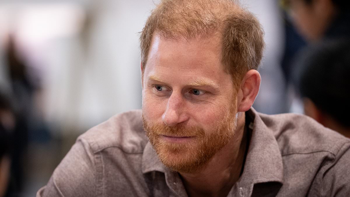 Prince Harry shows off his sporty skills as he plays a game of sitting volleyball with delighted children at Vancouver school