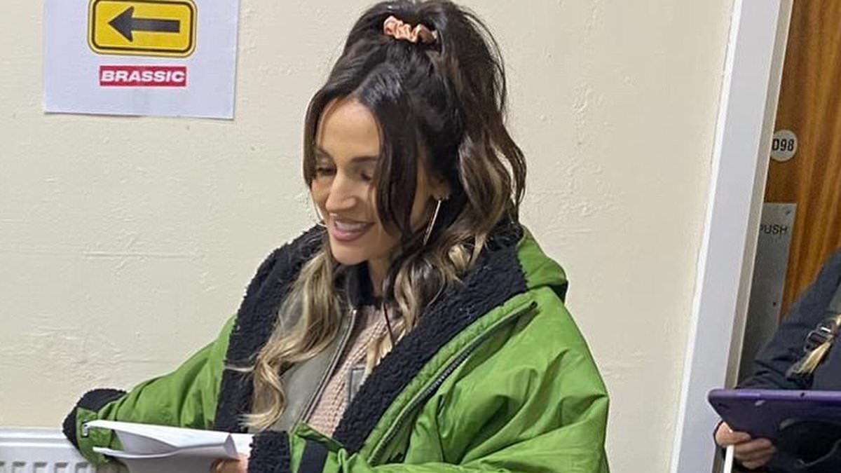 Pregnant Michelle Keegan conceals her blossoming baby bump with an oversized coat as she shares behind the scenes snaps filming Brassic