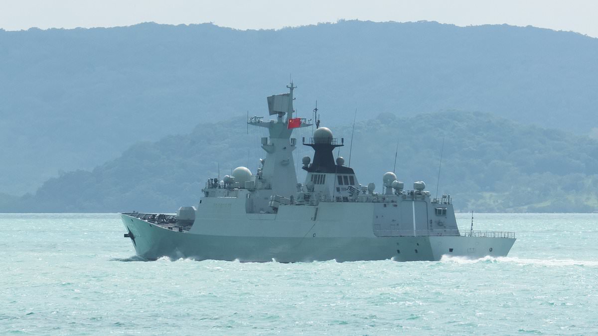 China flexes its military muscles as warships sail close to Australia in 'unprecedented' move of aggression while Beijing navy chopper buzzes within TEN FEET of Philippines coastguard plane