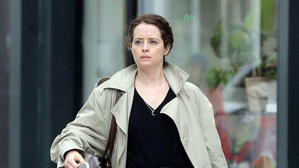 The Crown's Claire Foy cuts a casual figure in beige trench coat and dark jeans as she runs errands in Highgate