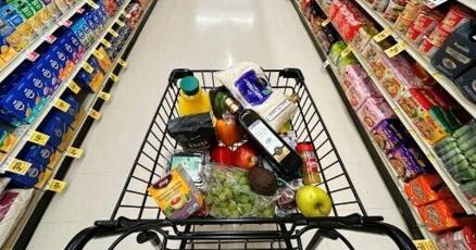 US indices power to fresh records after benign inflation data