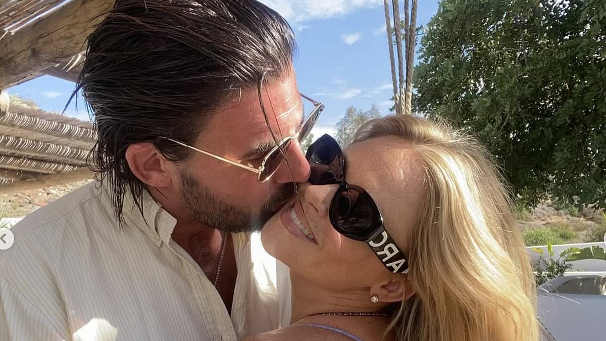 Emily Atack looks smitten with fiancé Alistair Garner during getaway