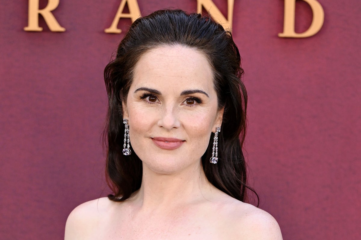 Downton Abbey star reveals she is pregnant with her first child at new movie premiere