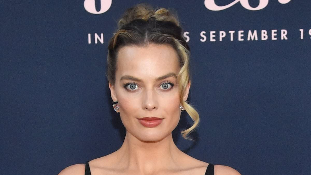 Margot Robbie shows off plenty of leg in skimpy dress