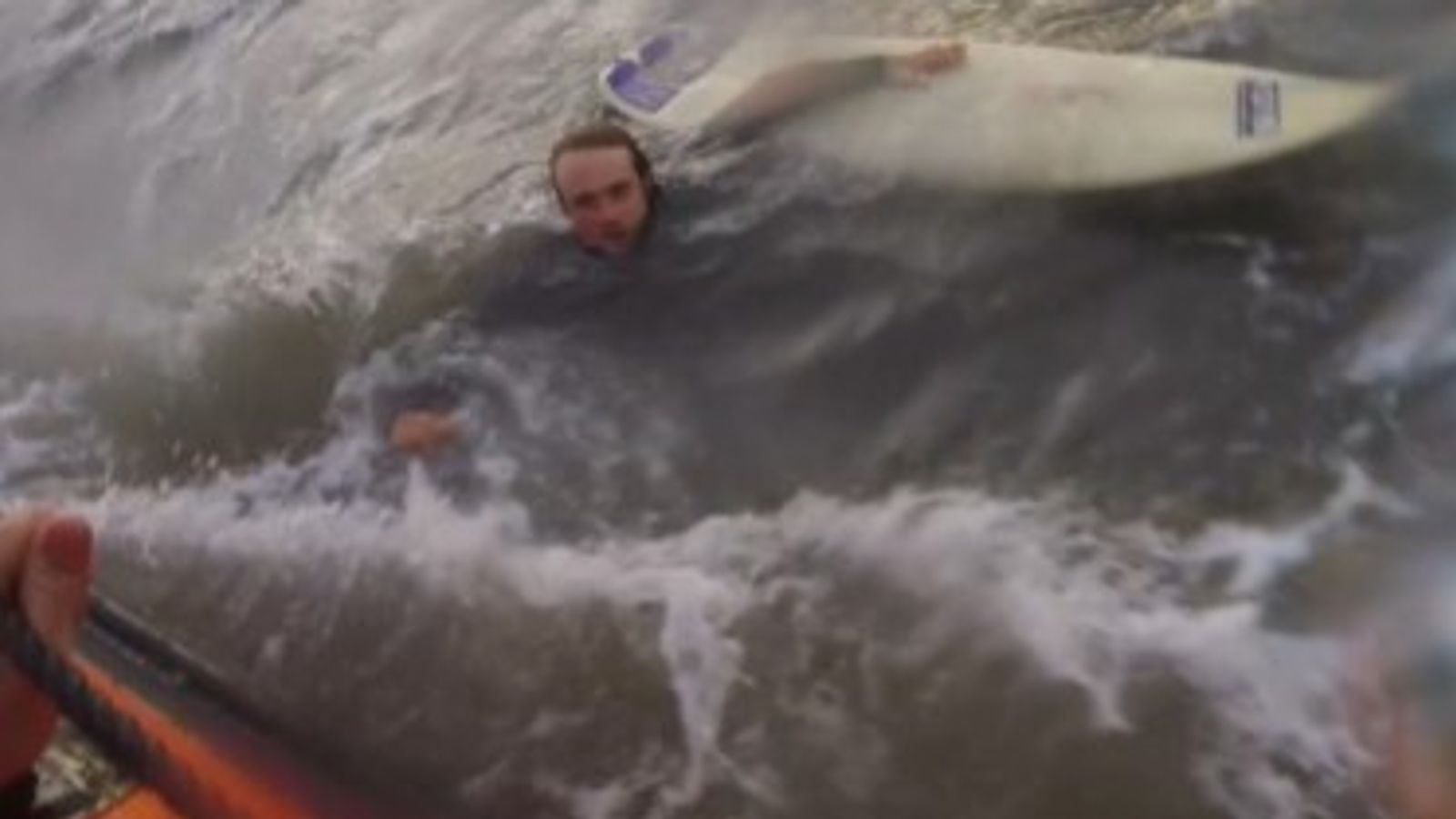 Video shows surfer being rescued after powerful rip current dragged him out to sea