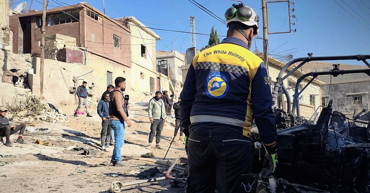 Israeli forces kill at least 13 people in southern Syria raid, officials and residents say