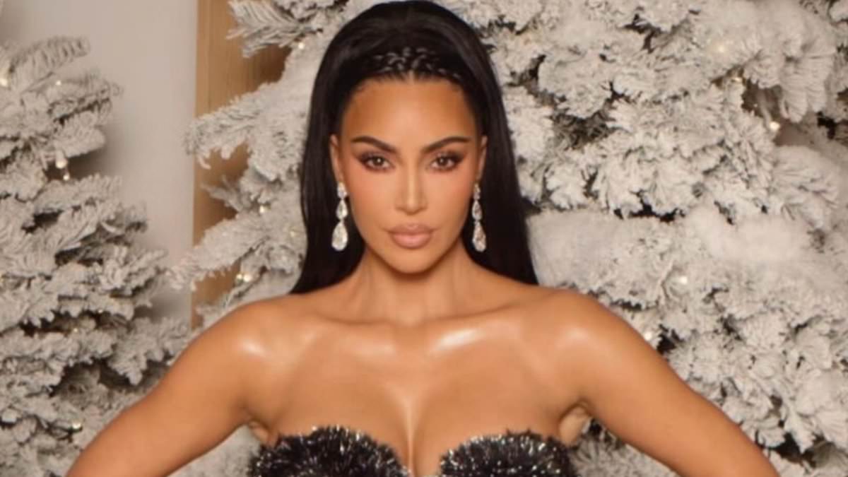 Kim Kardashian nearly spills out of daring Christmas dress as she reveals inspiration behind holiday look