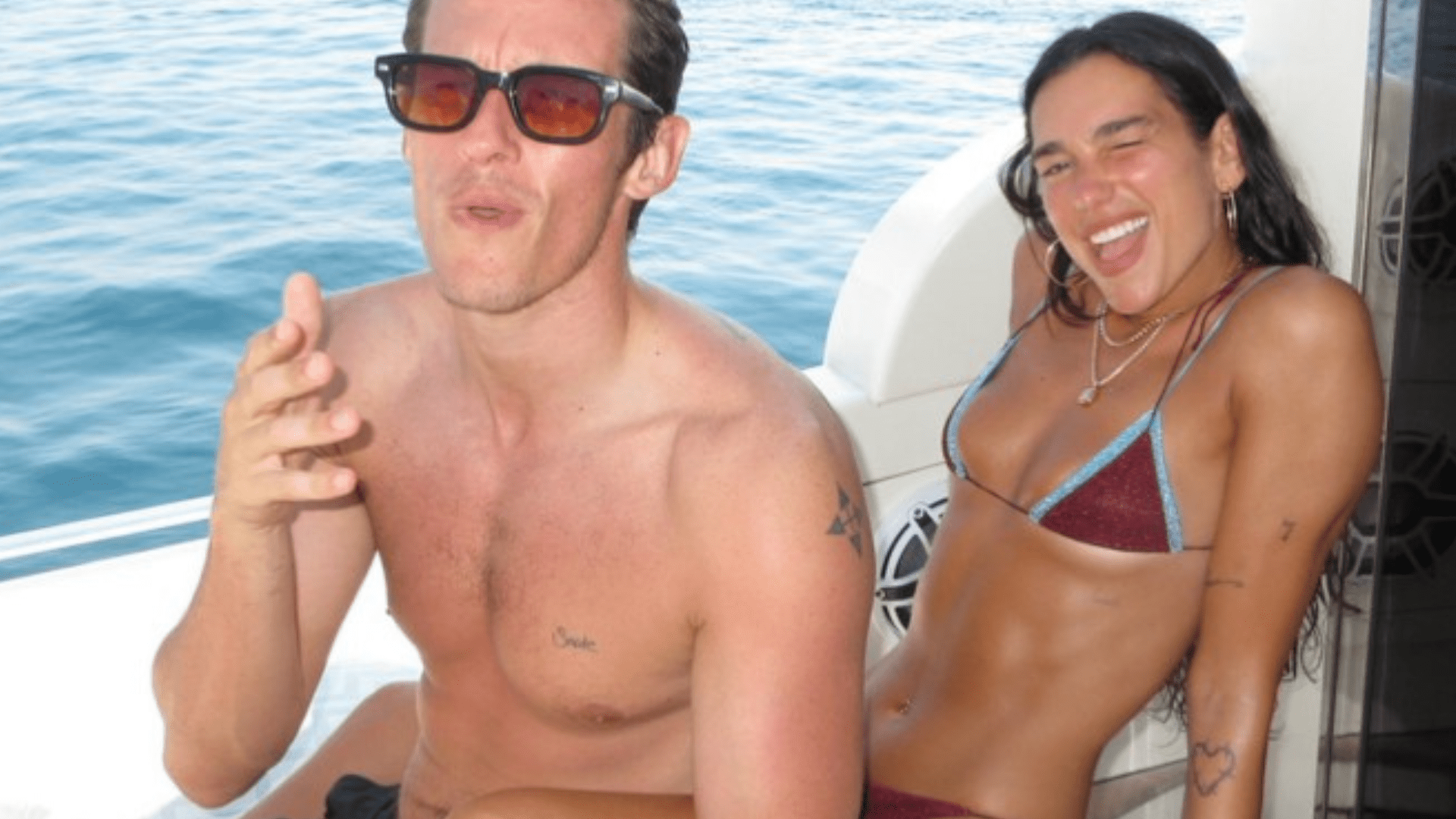 Dua Lipa sizzles in string bikini as she shares gushing birthday tribute to fiancé Callum Turner...