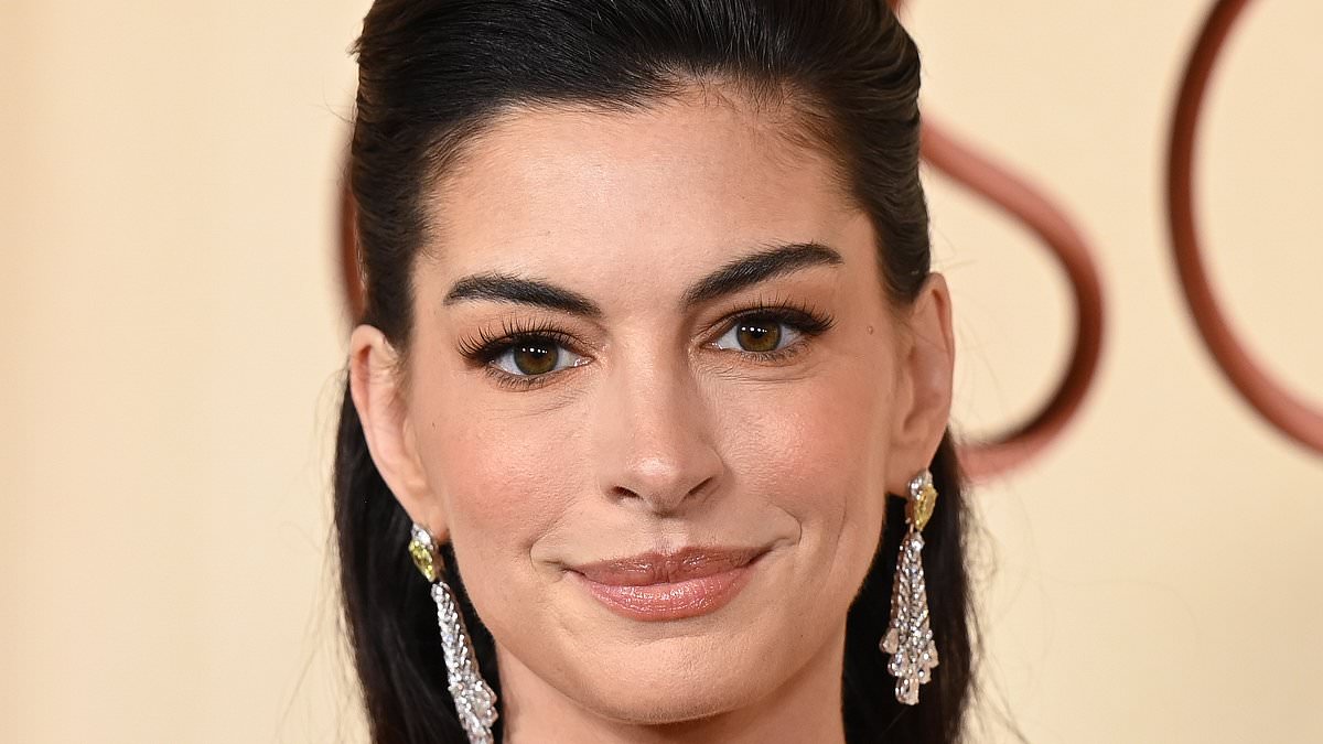 Anne Hathaway, 43, goes viral for taut face at Oscars as bewildered fans ask: 'What did she do and why?'
