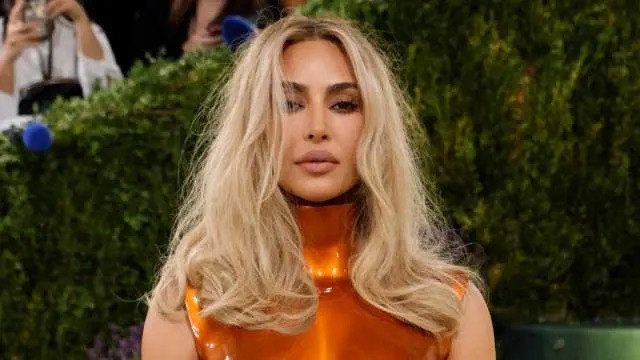 Kim Kardashian Flaunts Her Famous Curves in Nearly Unzipped Bodysuit