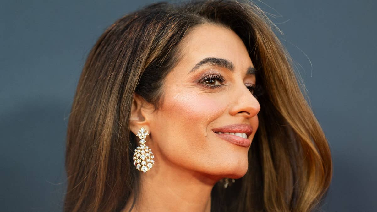 Amal Clooney just wore the slinkiest Prada dress in this season's hottest colour