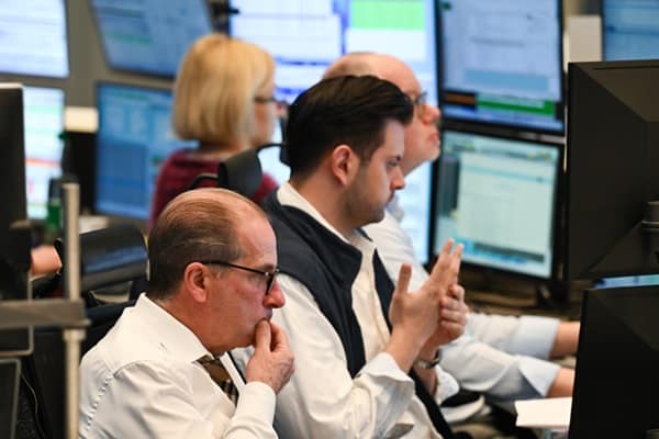 Markets split as investors question AI boom, inflation and global growth outlook