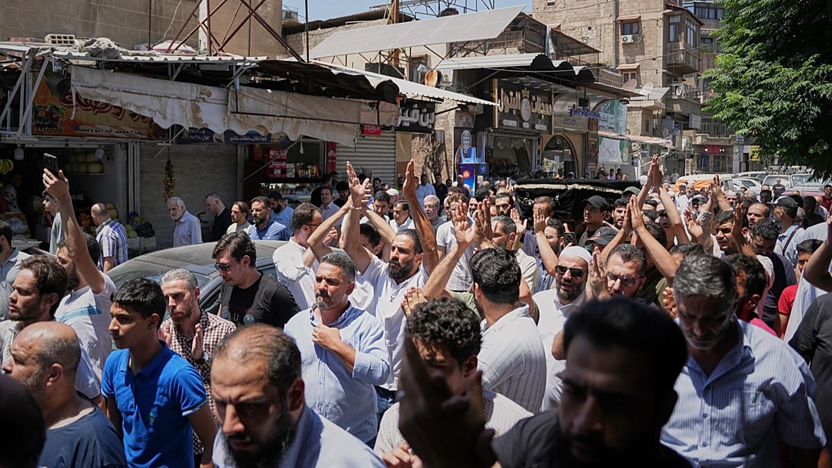 Mourners in Damascus bury blast victims as officials promise justice