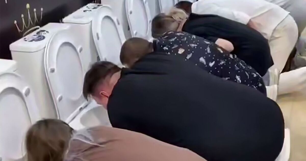 Sickening moment desperate Russians line up to drink out of toilets in bizarre public game