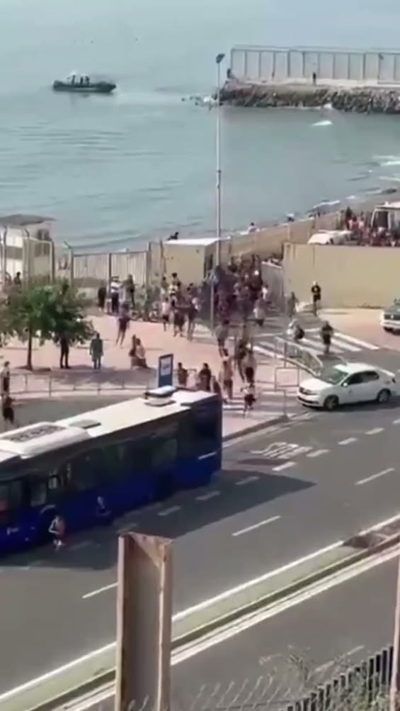 Scenes from Spain, which is currently experiencing a literal invasion, as hundreds of migrants are descending on its bea...