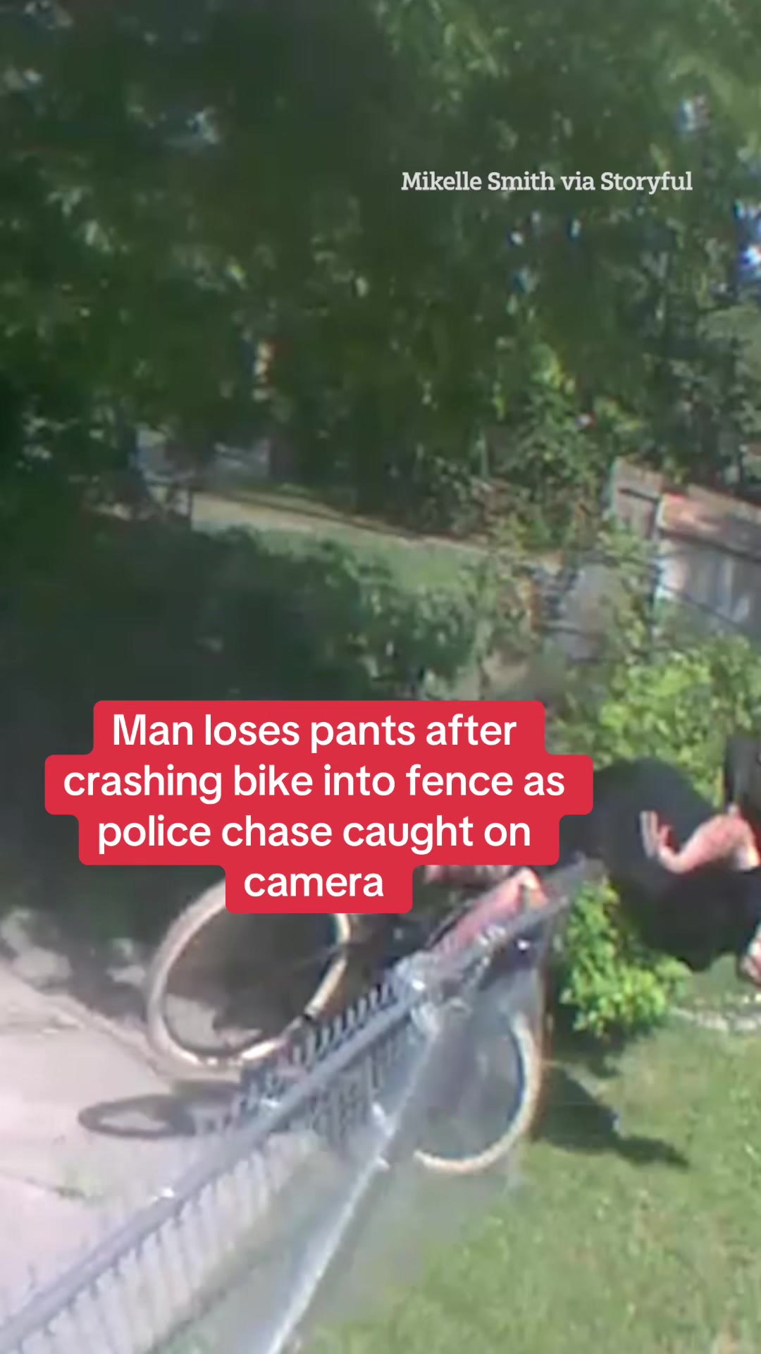 Watch the moment a man loses his pants after crashing a bike into a fence as police chase caught on camera. #Police #PoliceChase #Crash #Crime