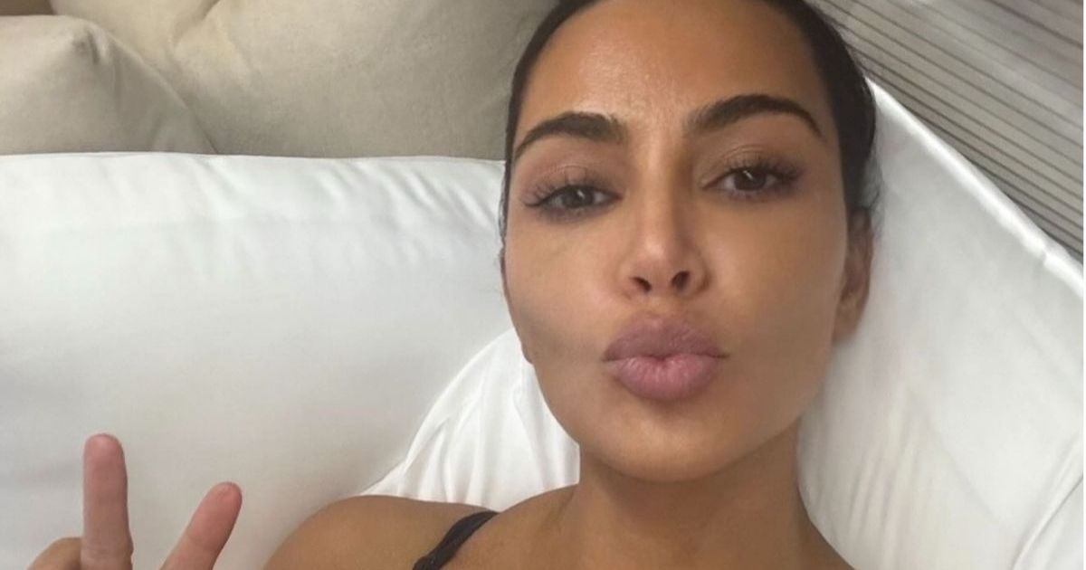 Kim Kardashian's Dangerously Plunging SKIMS Dress Is Also See-Through