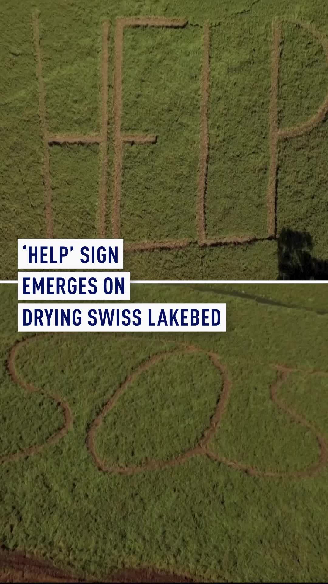 Giant "HELP" and "SOS" messages have appeared carved into the dried lakebed of Lac des Brenets along the French-Swiss border. With low rainfall and recurring heatwaves forcing navigation to a halt, local business owners describe the situation as catastrophic as tourist boats remain stranded on cracked earth. The ongoing drought marks the fifth major dry spell in eight years, threatening local livelihoods and pushing water levels toward historical record lows set over a century ago. #Switzerland #ClimateChange #Drought #LacDesBrenets