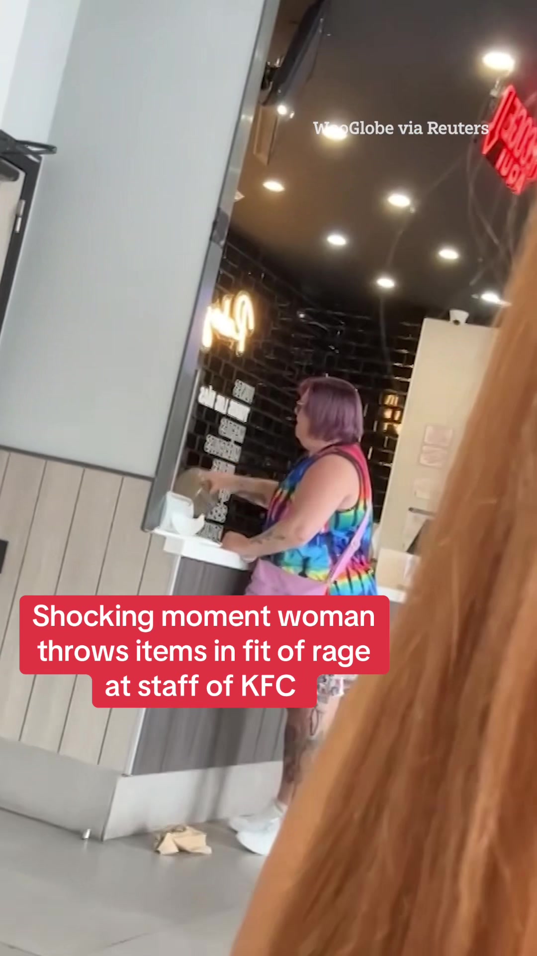 Watch the shocking moment woman throws items in fit of rage at staff of KFC. #KFC #News #Viral