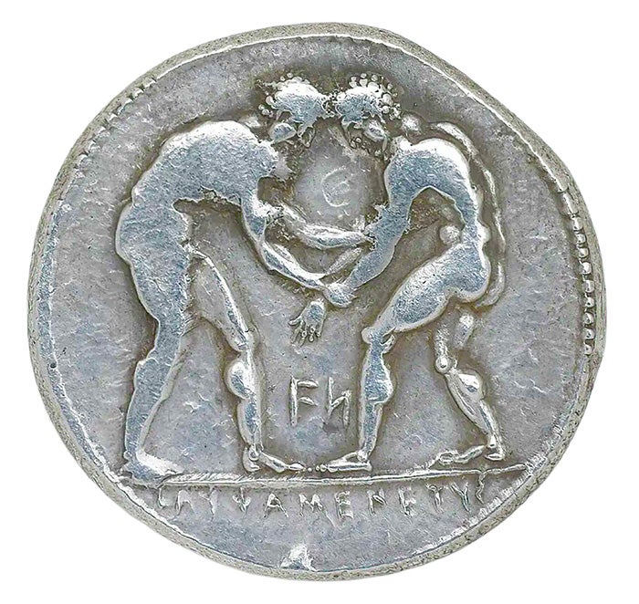 Around the World: Grave Yields Coins Featuring Wrestling